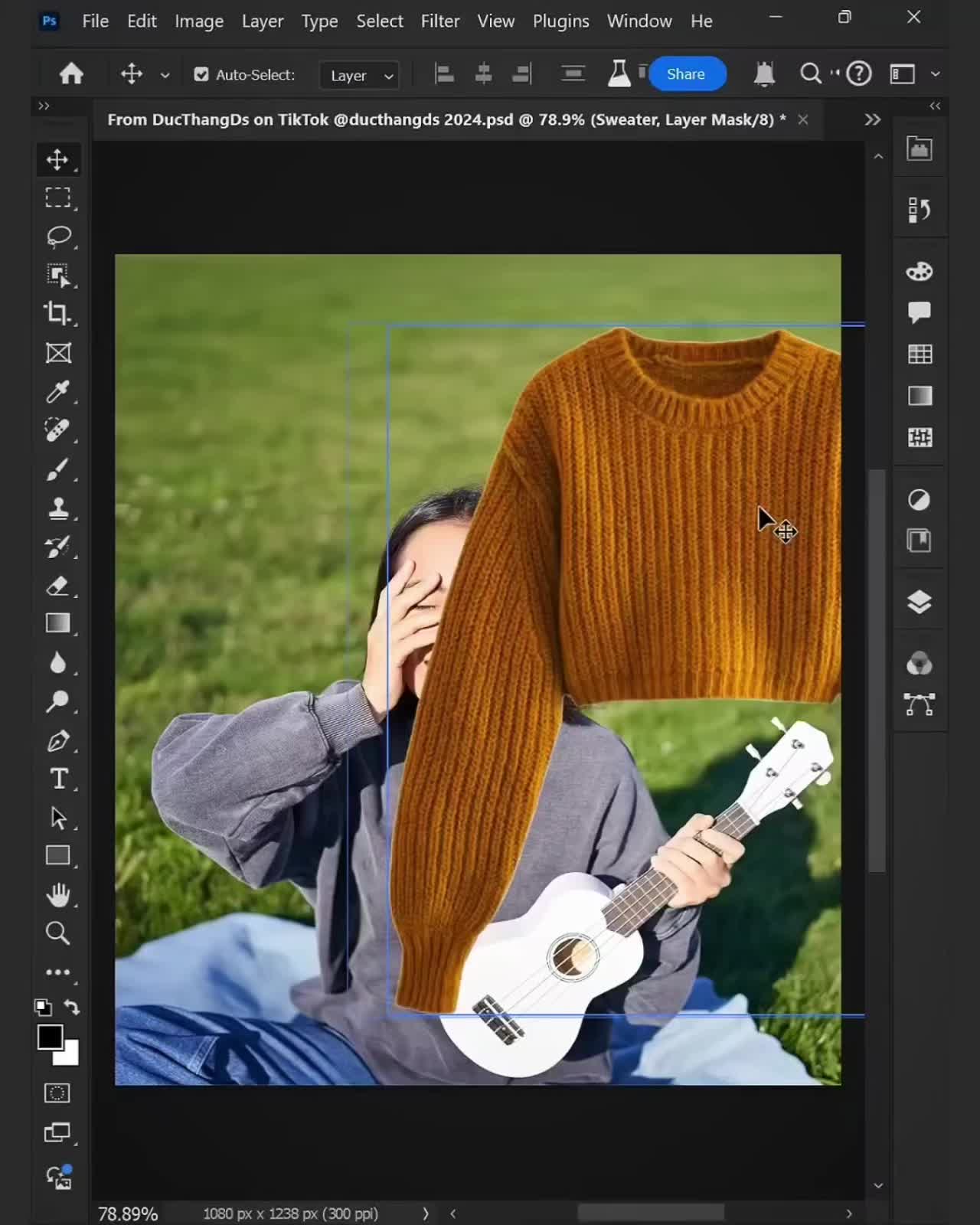 This may contain: an image of a man holding a guitar in front of his face and wearing a sweater