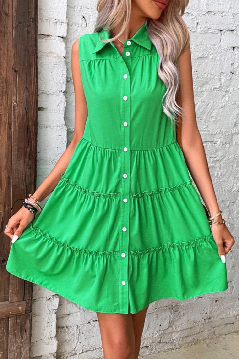 This contains: Make a statement on vacation or day-to-day with the Madison Summer Casual Loose Sleeveless Ruffle Beach Dress. Crafted with a lightweight fabric, this dress will keep you feeling cool while looking fashionable. Its elegant design features a ruffle hem and green button detailing. Stay comfortable and stylish all summer long.