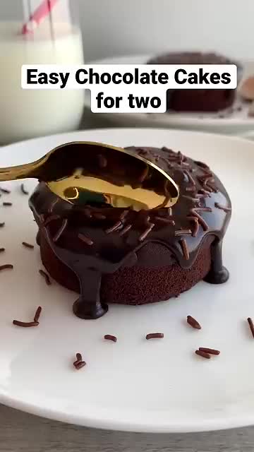 This may contain: a chocolate cake on a plate with the words easy chocolate cakes for two