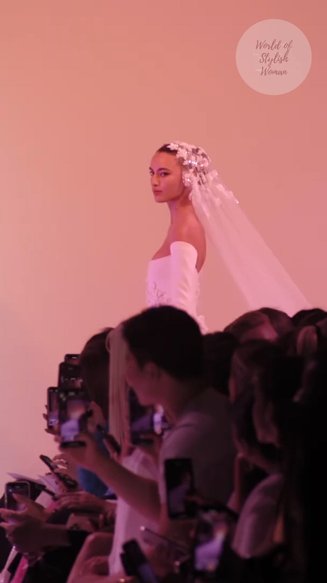 This contains: Stunning white off shoulder wedding dress / wedding gown with long sleeves. Fall Winter 2023 / 2024 Haute Couture Collection. Runway Fashion Show by Georges Hobeika.