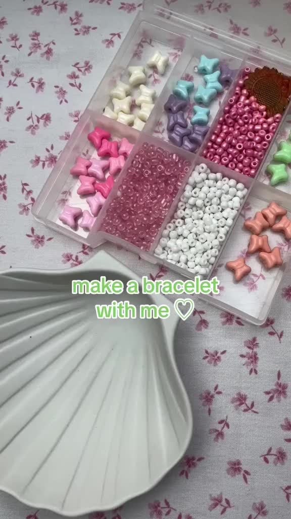 This may contain: a plastic container filled with lots of different types of bows on top of a table