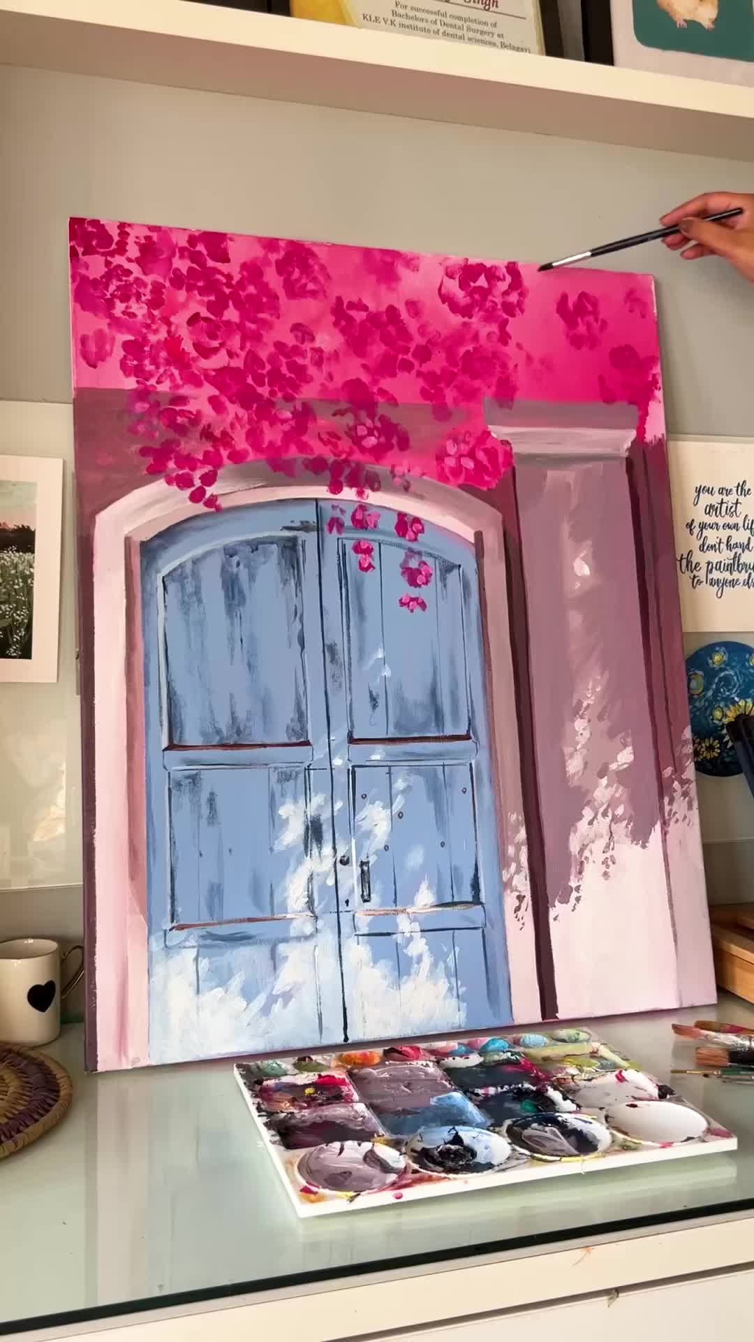 This may contain: an art work with pink flowers on the window sill and blue shutters in front of it