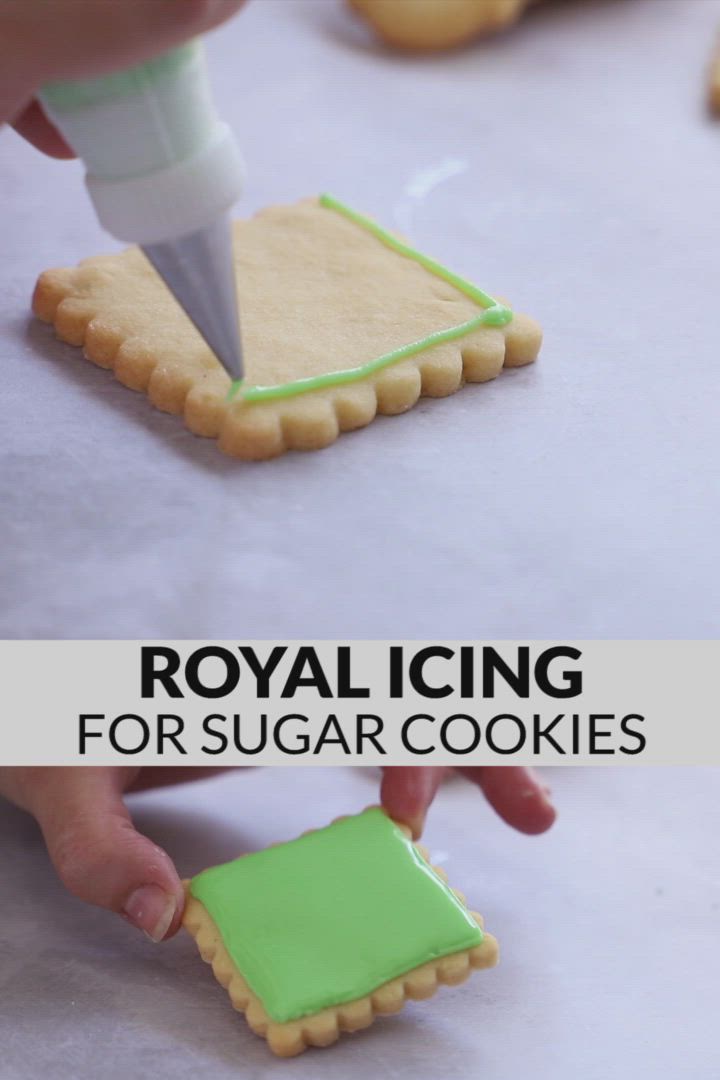 This may contain: royal icing for sugar cookies is being used to decorate cookies