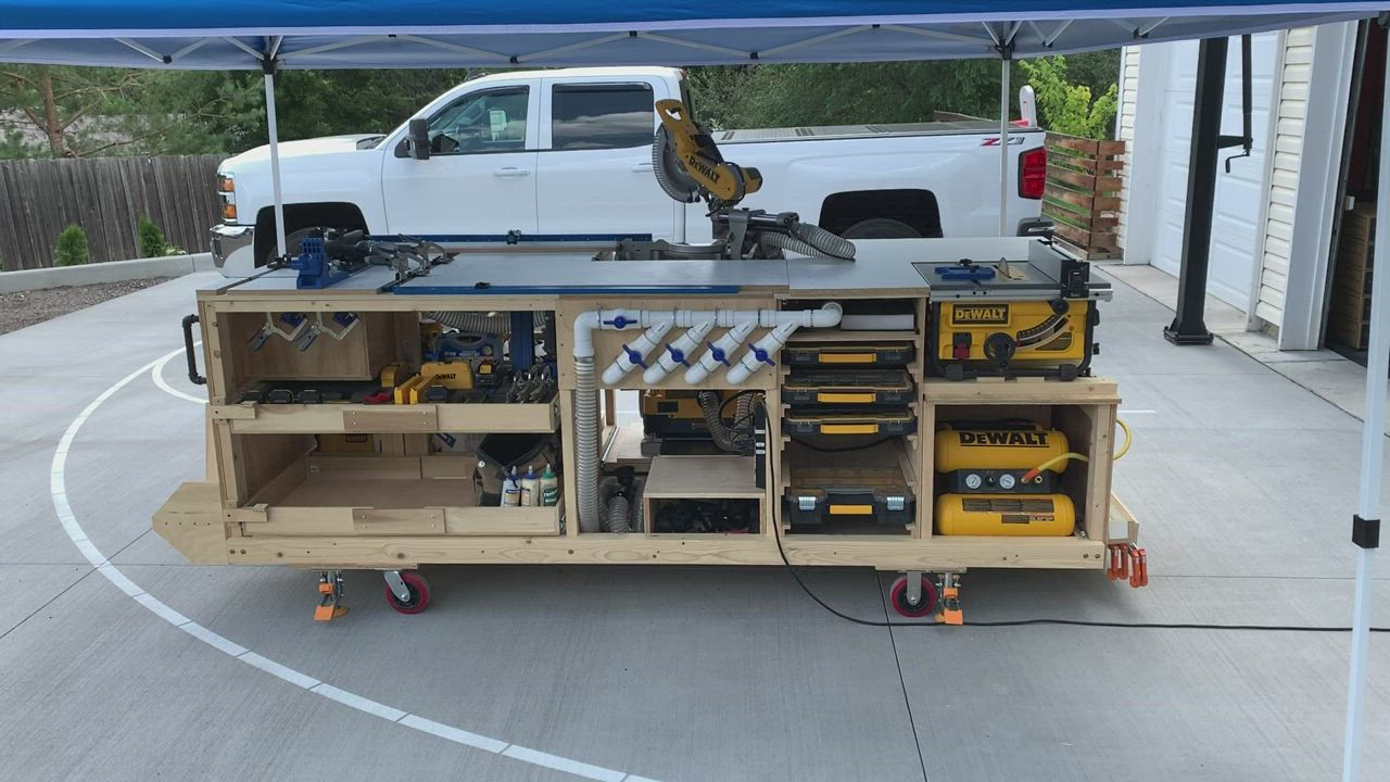 This may contain: a work bench with tools on it under a tent