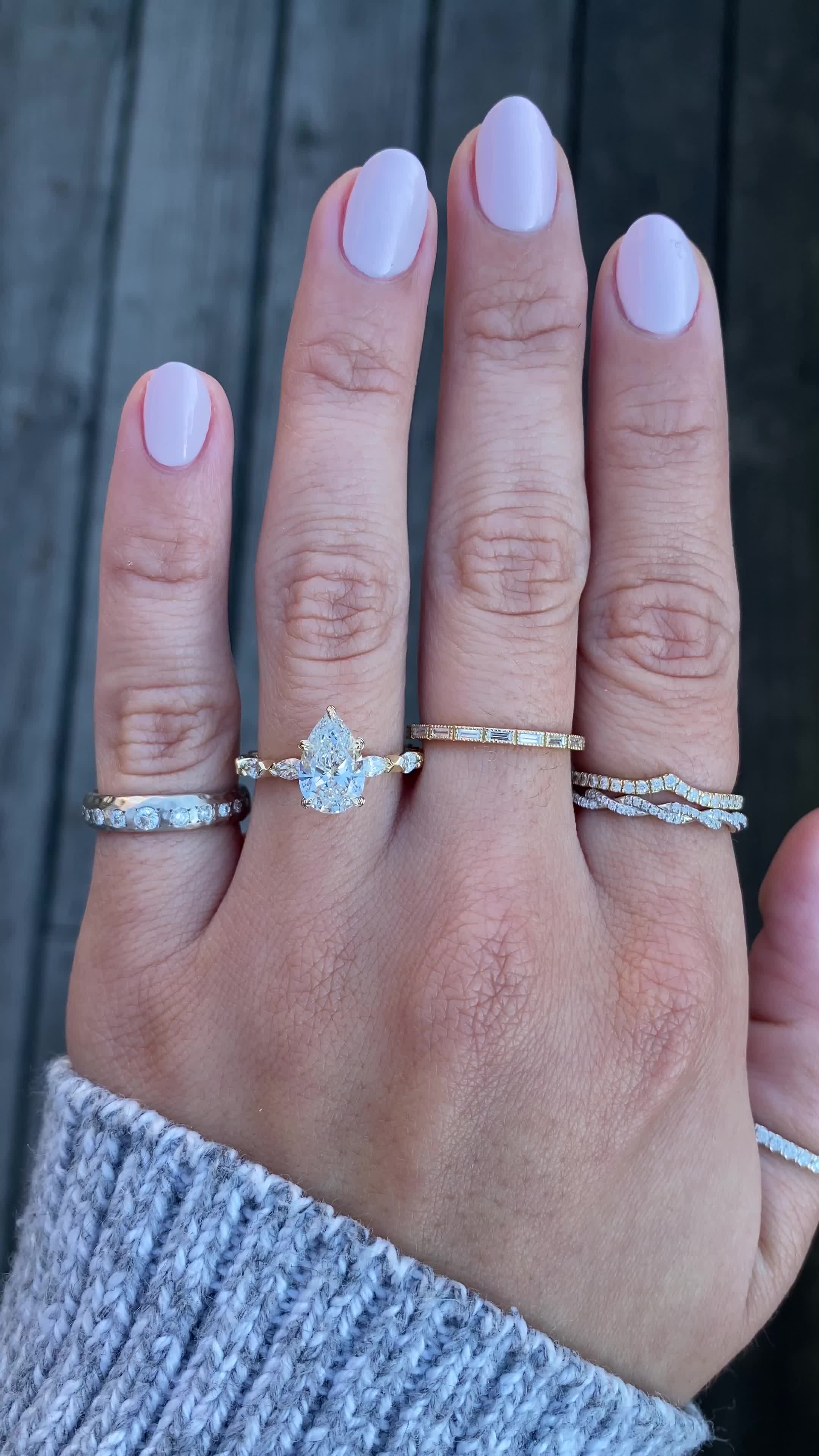 Inspired by our Carissa design, Elaine is a pear cut diamond engagement ring featuring a hidden halo and a delicate band with marquise shape diamonds. Our signature leaf detailing is carved into the center stone prongs. Approx Band Width (mm): 2.25mm- 1.80mm Setting Diamond Quality (side stones): Colorless and VS clarity Approx Setting Total Carat Weight (side stones): 0.647 tcw Approx Production Time: 5-6 weeks Drop-down diamond options represent our recommended grade, which maximizes size for 