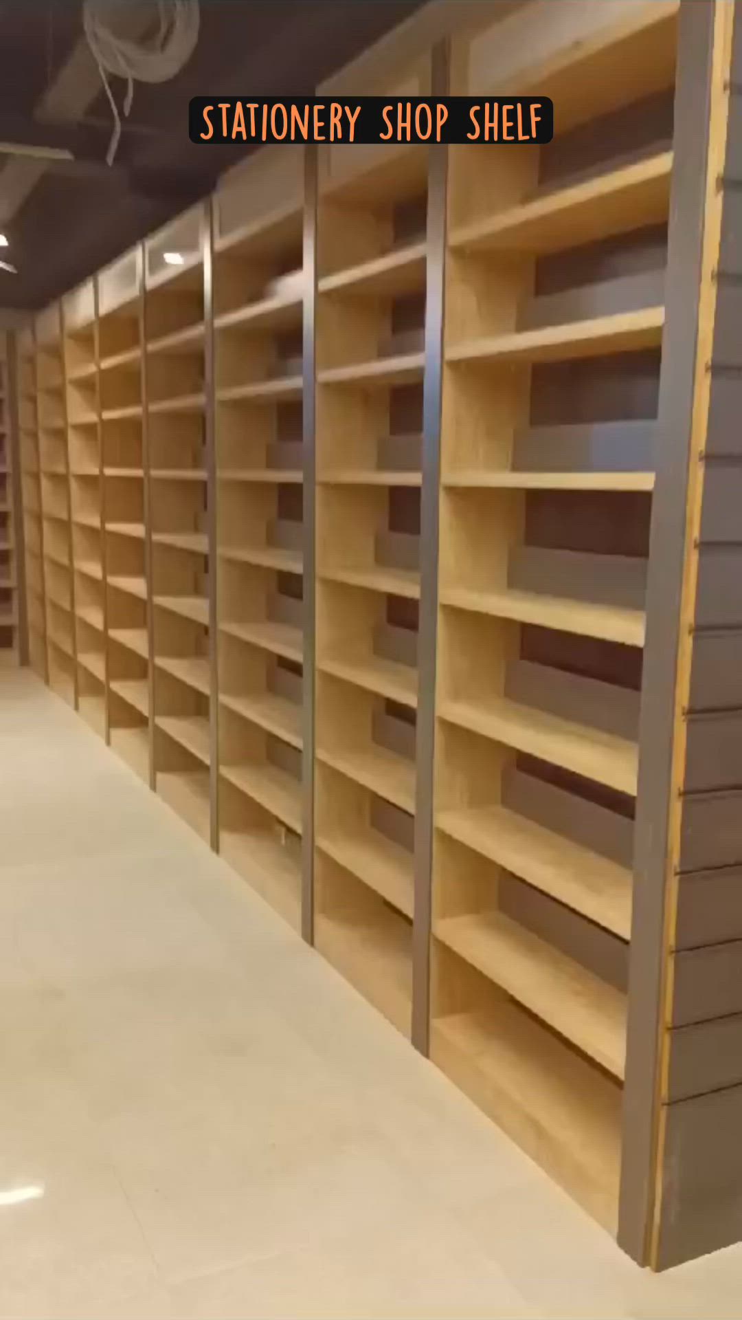 This may contain: a large book shelf with many books on it in a room that has no people