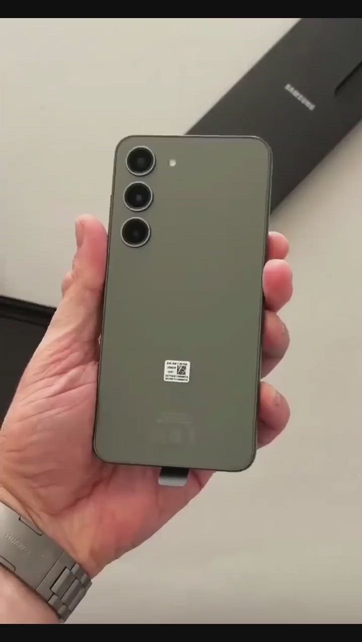 This may contain: someone is holding their new oneplus phone