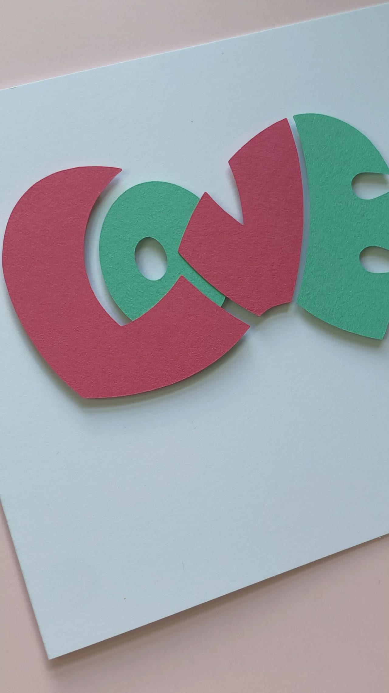 This may contain: two pieces of paper cut out to look like the letters q and o on top of each other