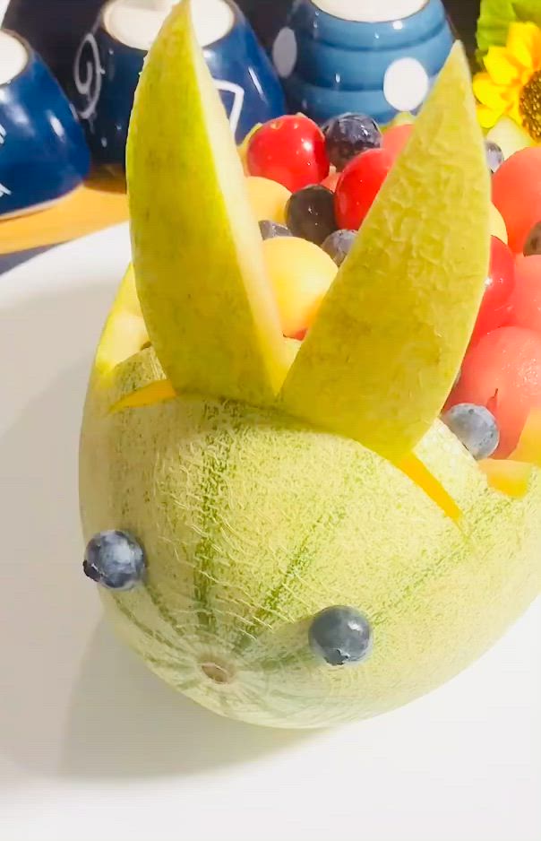 This may contain: there is a fruit bowl made to look like an animal