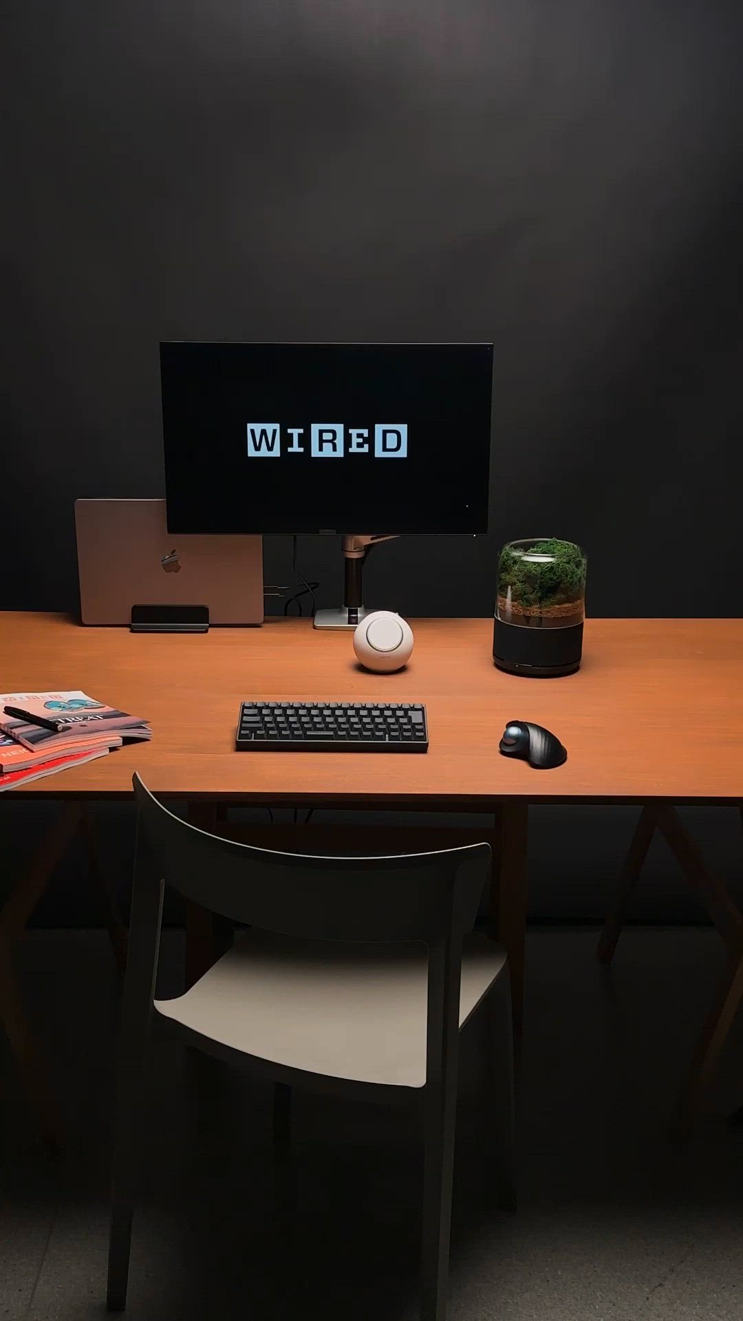 This may contain: a desktop computer sitting on top of a wooden desk