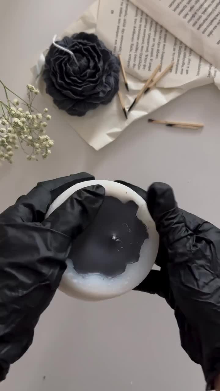 This may contain: the gloves are being used to make fake flowers