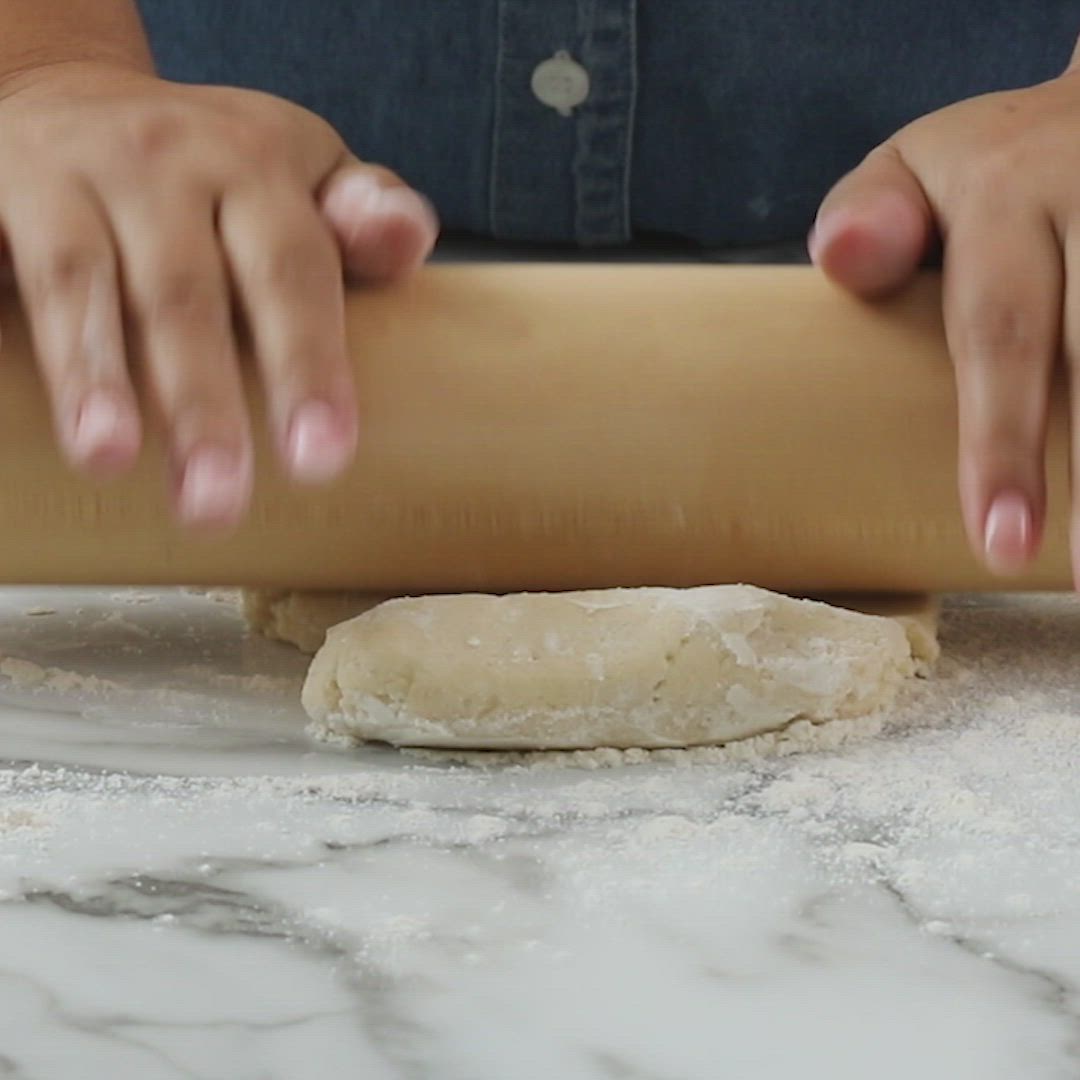 This may contain: the best sugar cookies on a black plate