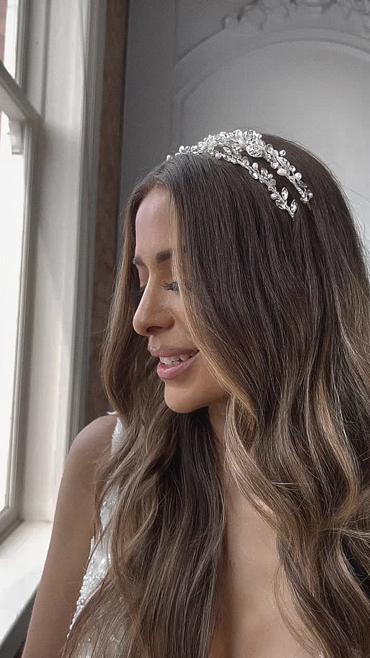 MAEVE Freshwater Pearl Bridal Crystal Headband WHAT WE LOVE: This beautifully delicate Bridal Headband Tiara has been created with beautiful sparkling crystal bejeweled leaves and creamy genuine freshwater pearls... creating an ethereal look that becomes an instant heirloom headpiece with its classic style and elegance. This headband is also modern enough to wear even after the wedding is over. DETAILS: Austrian Crystals and Freshwater Pearls This tiara's classic styling and truly regal elegance