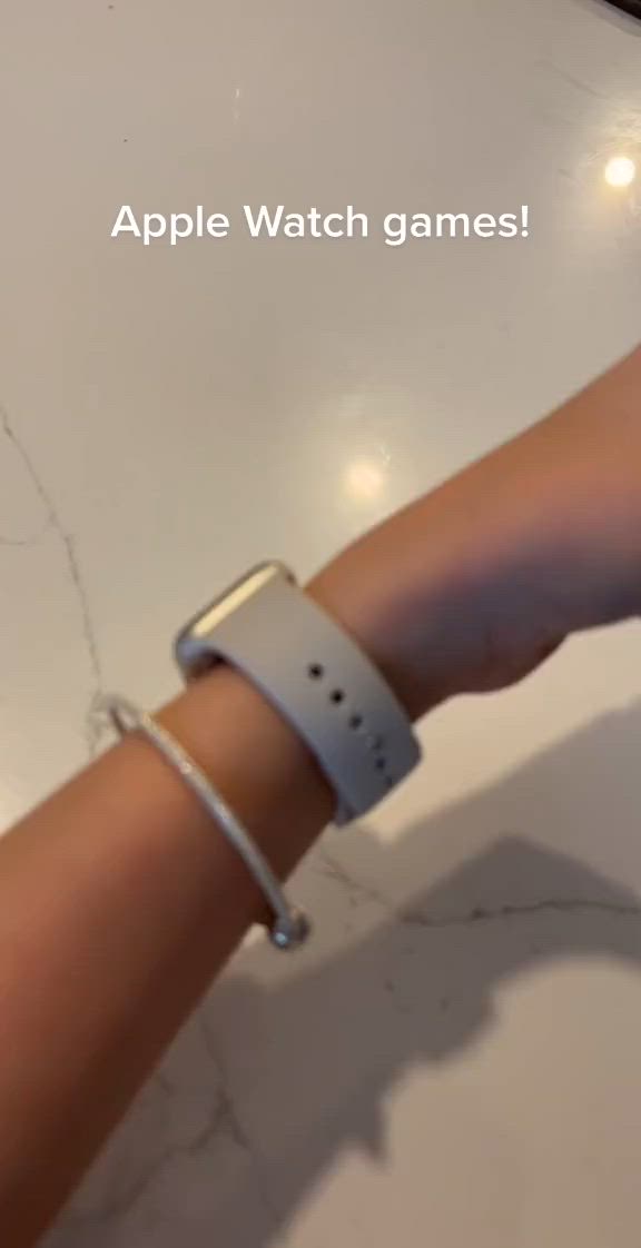 This may contain: an apple watch on someone's wrist with the words apple watch games above it