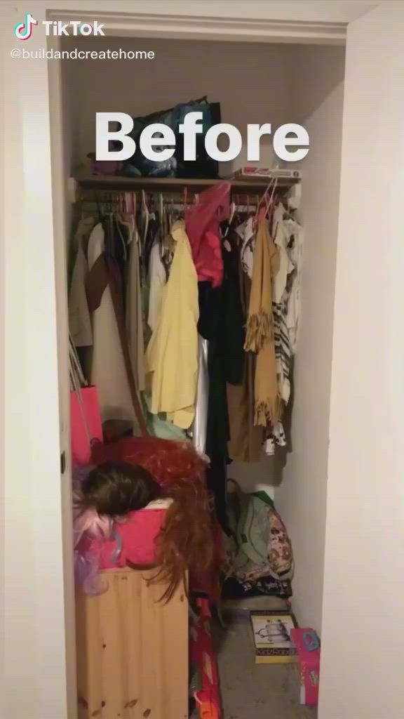 This may contain: an open closet with clothes hanging from the ceiling and a woman's head in it