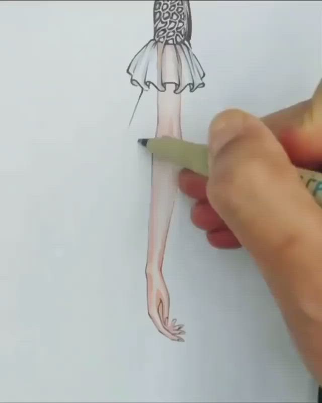 This may contain: a drawing of a woman's dress on a piece of paper with a marker