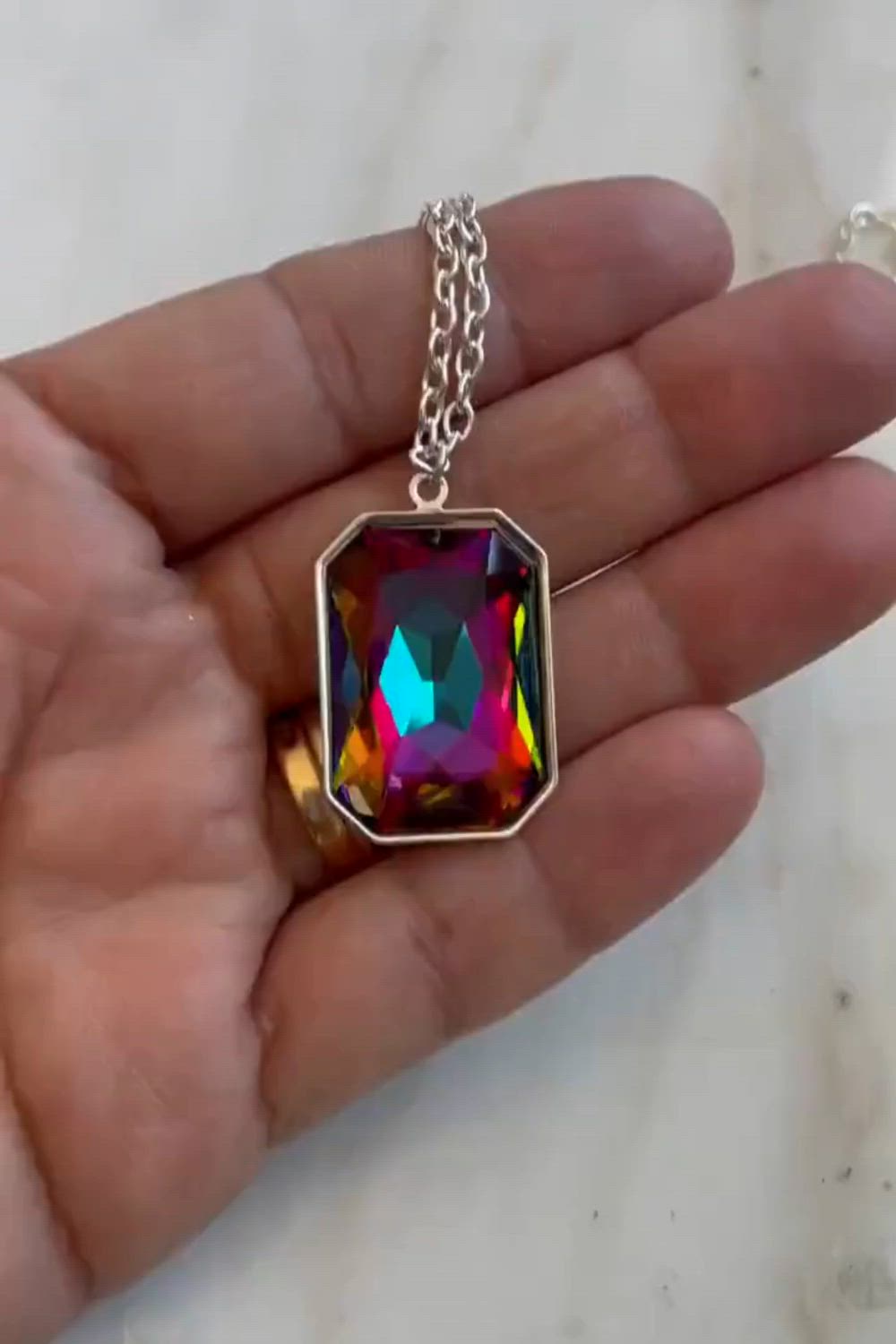 This contains an image of: Crystal rainbow pendant