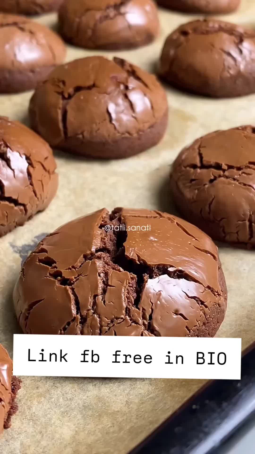 This may contain: chocolate cookies that have been cut in half on a baking sheet, ready to be baked