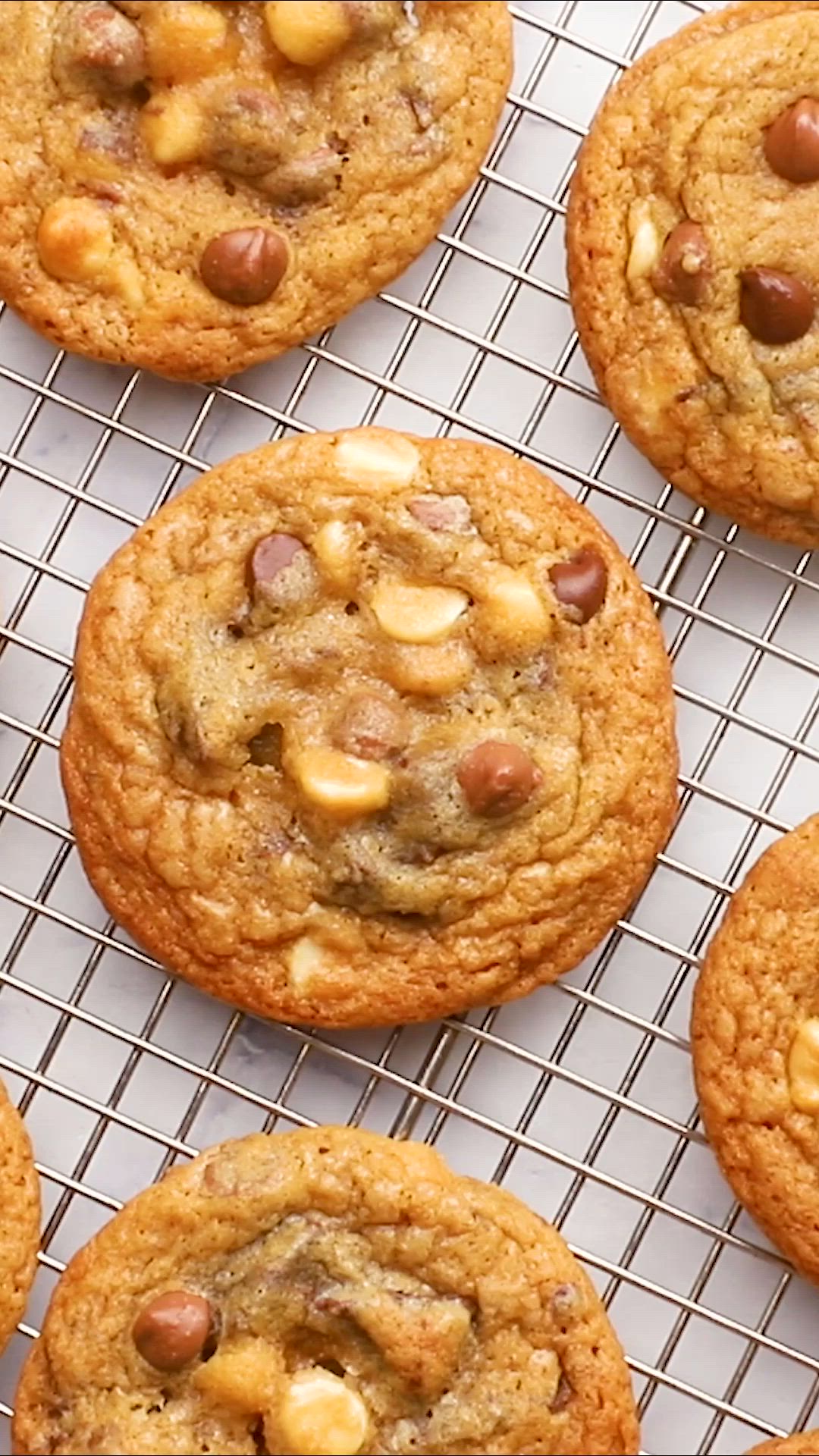 This may contain: a close up of a person holding a cookie