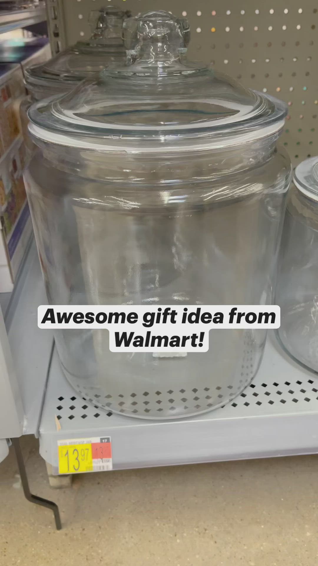 This may contain: a large glass jar sitting on top of a shelf next to two smaller plastic containers