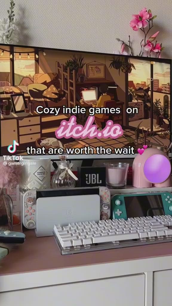 This may contain: a desk with a keyboard, mouse and monitor on it that says cozy inside games on techio that are worth the wait