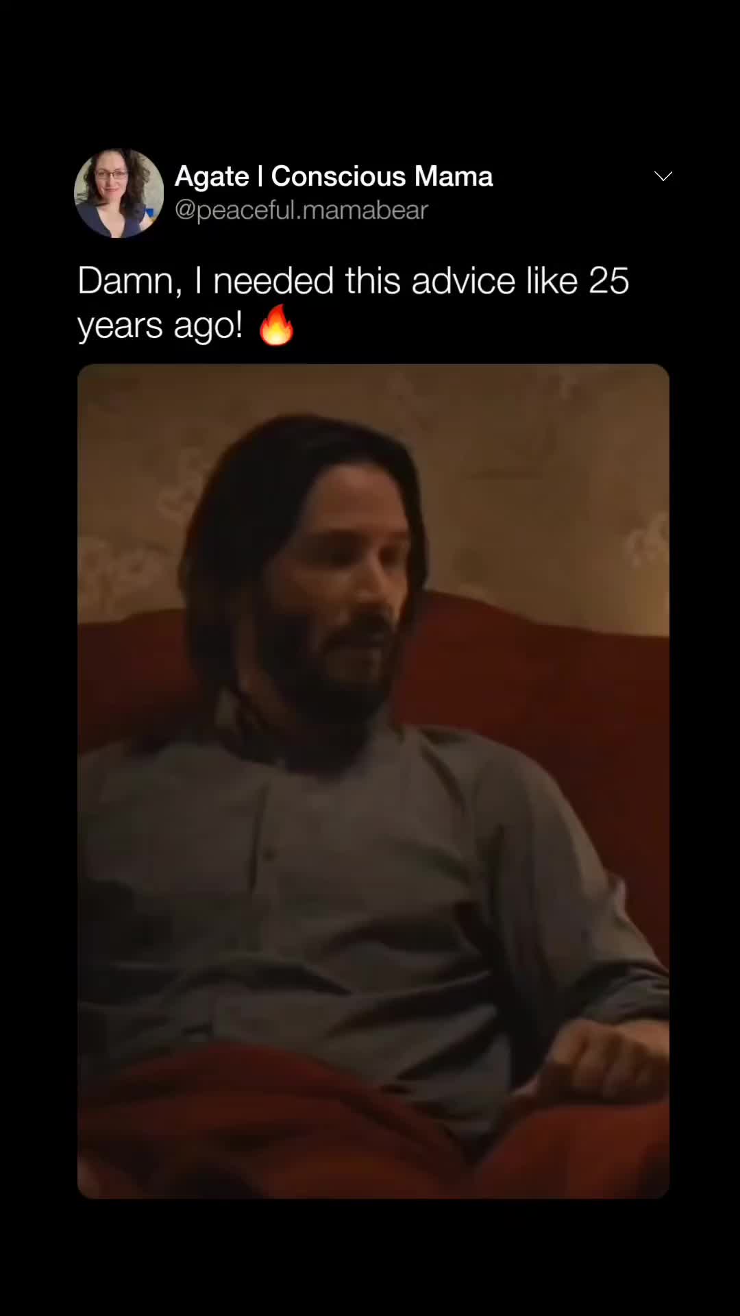 This may contain: a man with long hair and beard sitting on a couch