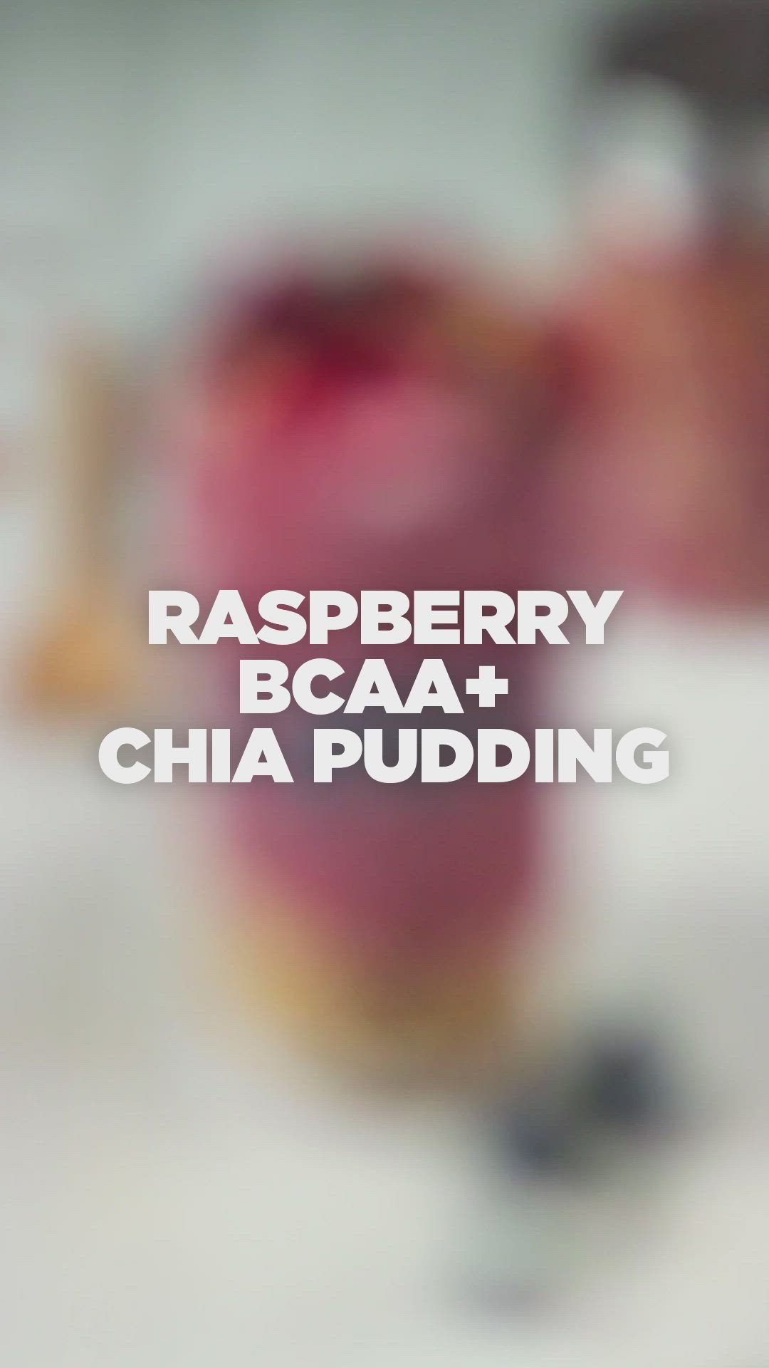 This may contain: raspberry bcaa and chia pudding in a jar with berries on top