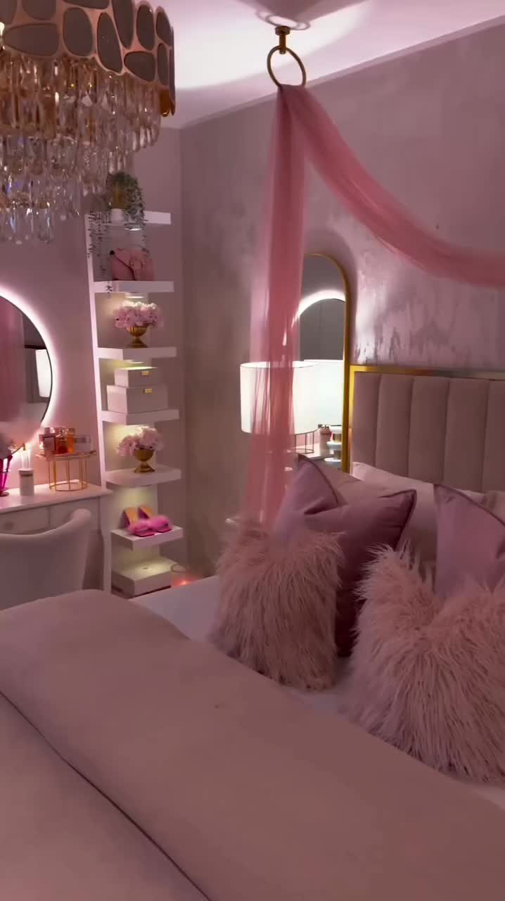 This may contain: a white desk with a mirror and lights on top of it in a pink room