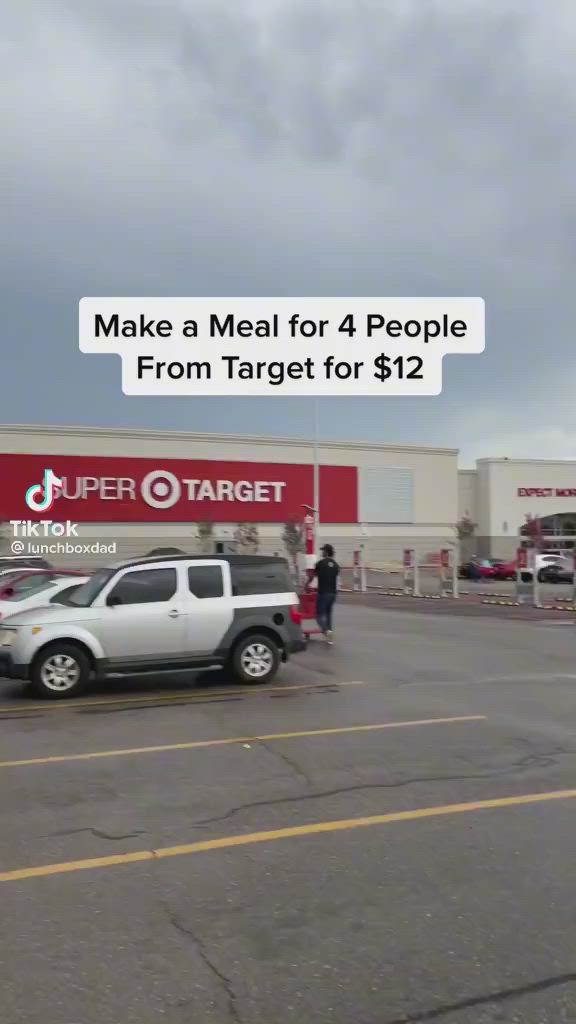 This may contain: a group of cars parked in front of a target store