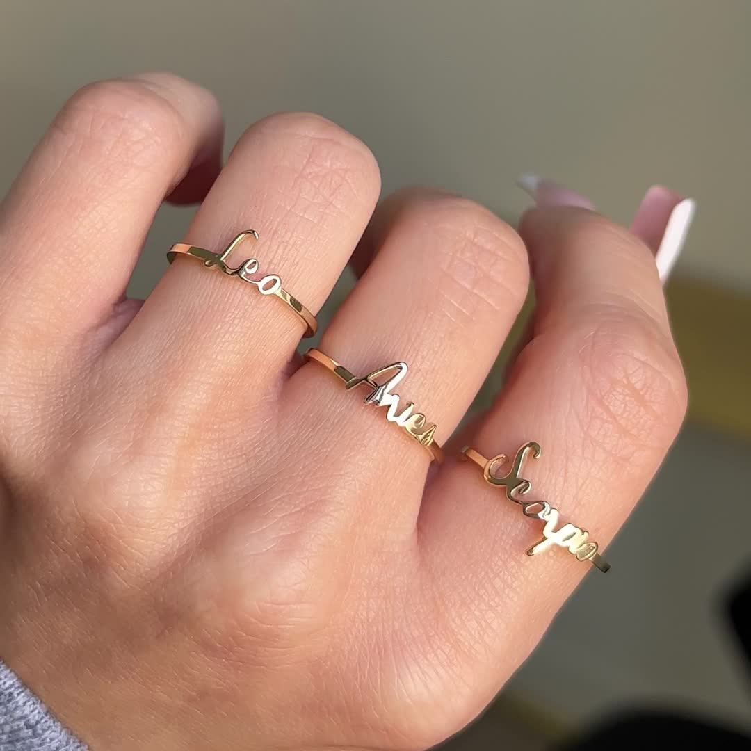 Our Zodiac Script Ring is the perfect way to wrap your astrological energy right around your finger. Each zodiac is beautifully written out in our own script font style. Available in Yellow, White or Rose 14K Gold. Treat yourself or gift your loved one to our Zodiac Script Ring!

Size: 8-10mm letter height 
14K Solid Gold
Made in Los Angeles
Lifetime Guarantee