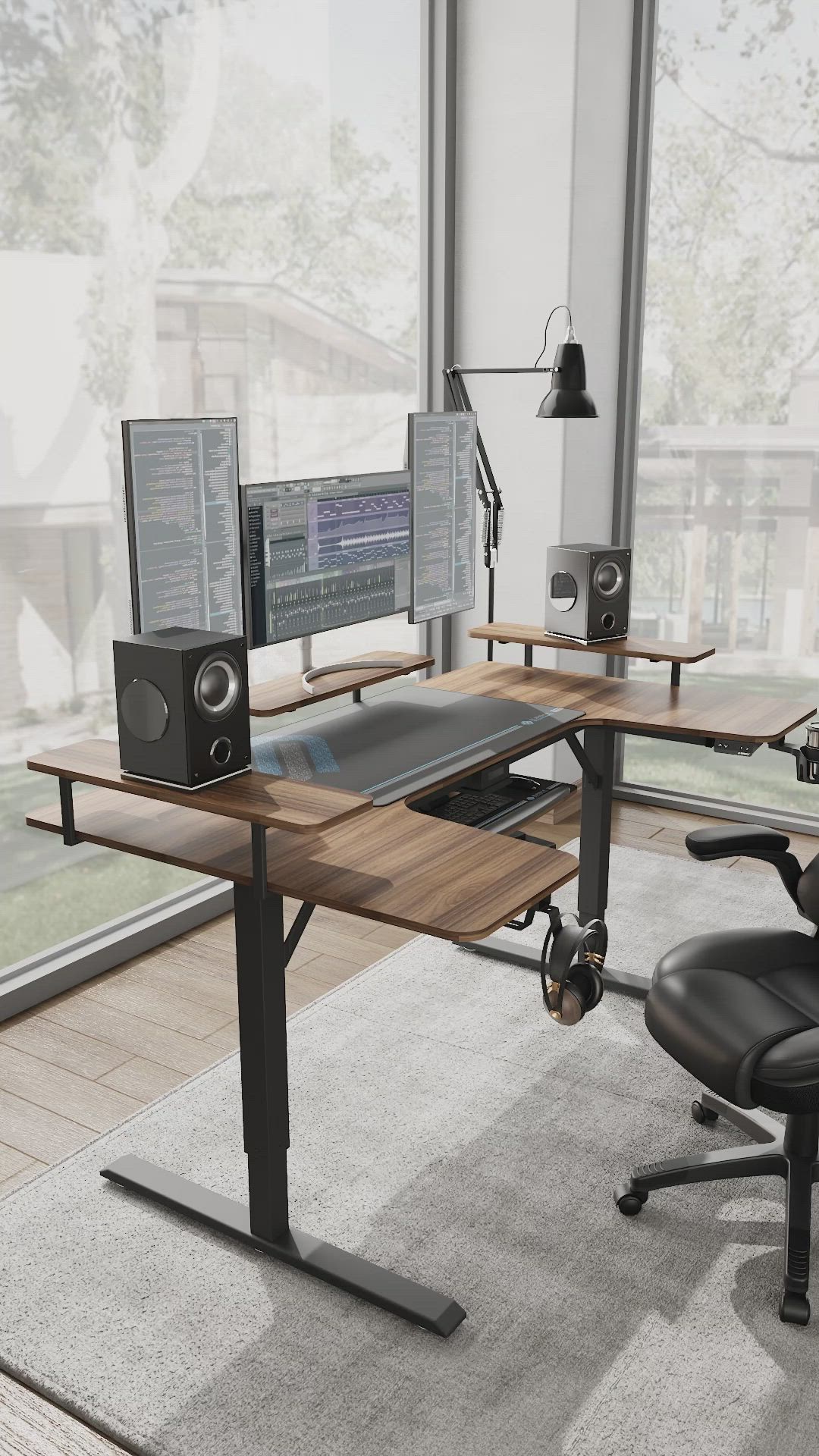 This may contain: a computer desk with two monitors, speakers and a chair in front of the window