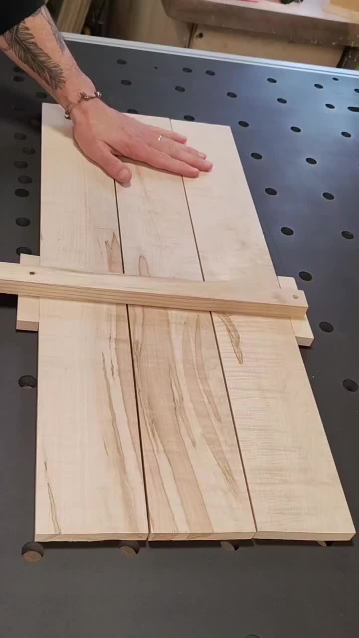 This may contain: a person is making wooden planks out of plywood