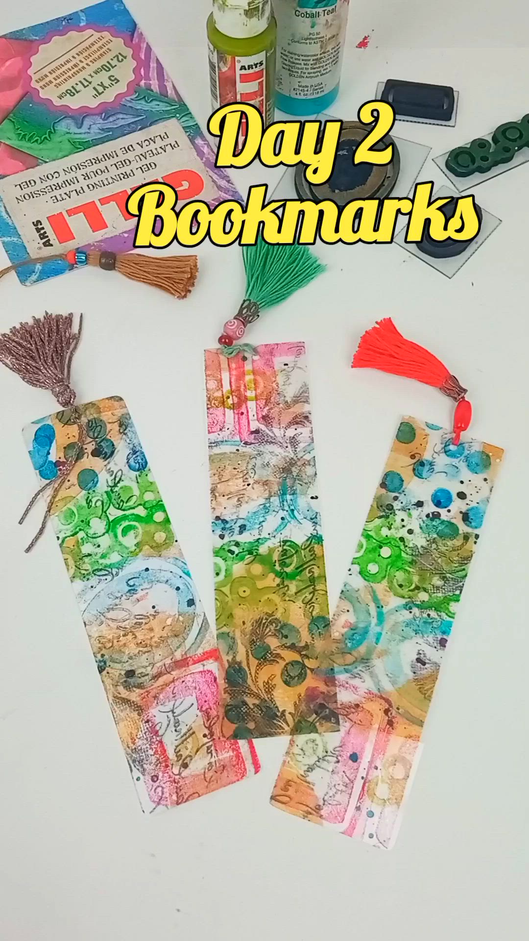 This contains: Gelli Arts® artist Giovanna Zara demonstrates how she gel prints on clear tape and then uses that tape to create transparent bookmarks.