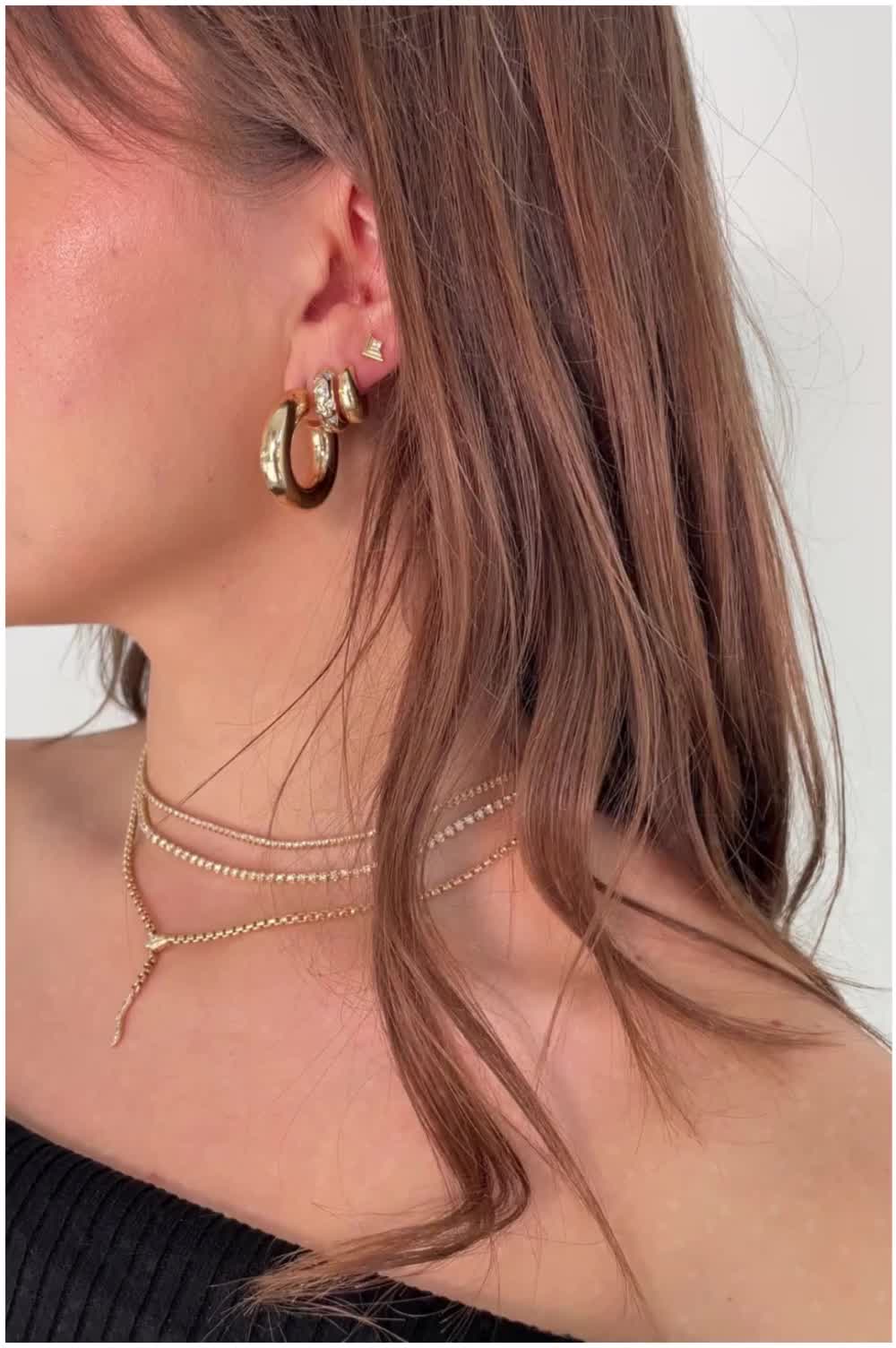 Elevate your look with our stunning gold jewelry selection! From delicate necklaces to statement rings, our collection offers a wide range of pieces to suit every style and occasion. Shop now and make a statement with our luxurious designs.