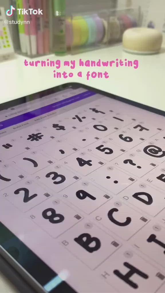 This may contain: a tablet with an image of the keyboard and numbers on it that says turning my handwriting into a font