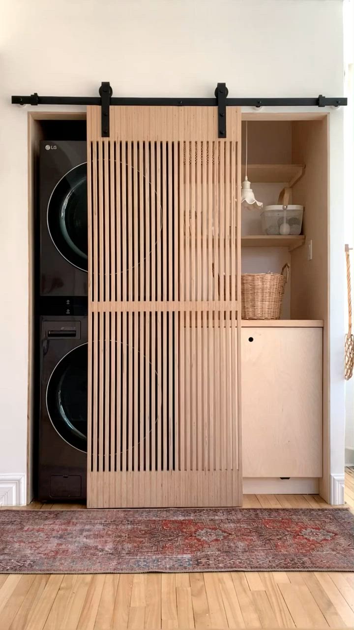 This may contain: a washer and dryer sitting in a room next to each other on top of a rug