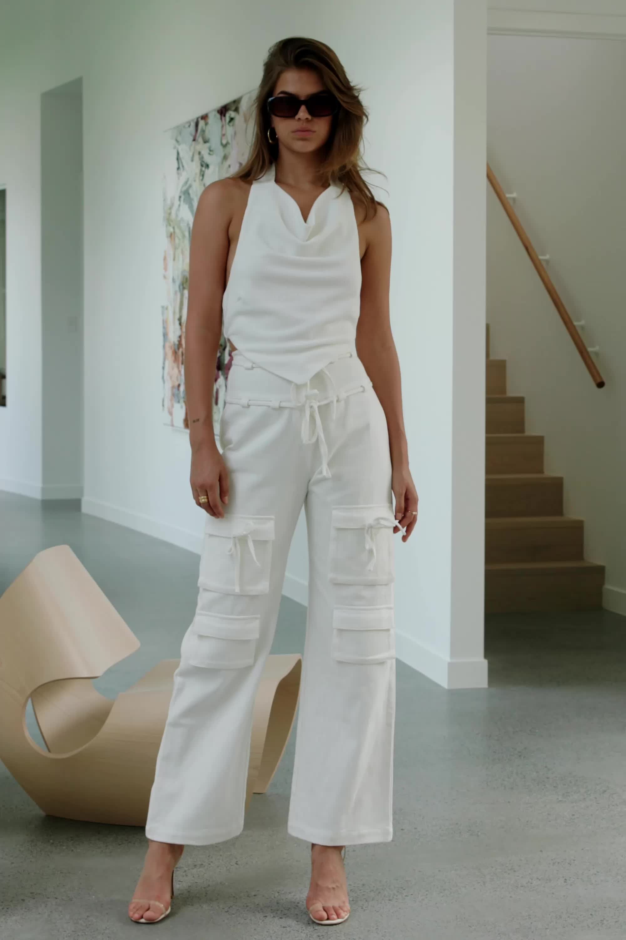 A fashion-forward staple that you can style your way! The Jaicee Pants are made from a structured cotton denim in white. They are a high waisted style featuring a clasp and zip fly, twin ties at waist, pocket details and relaxed fit through the legs. Style with the contrasting Serano Top! Designed exclusively by Sabo.