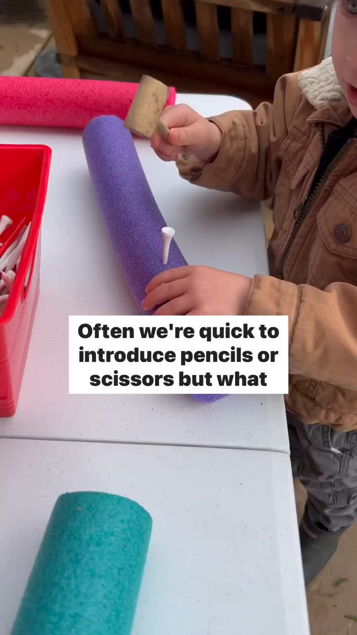 This may contain: a little boy that is playing with some kind of thing on the table in front of him