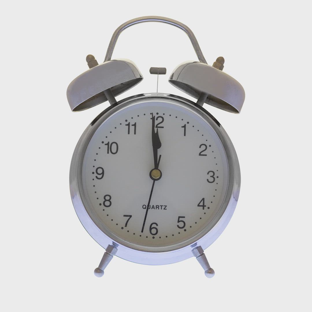 This may contain: an alarm clock is shown with the hands pointing to five o'clock on each side