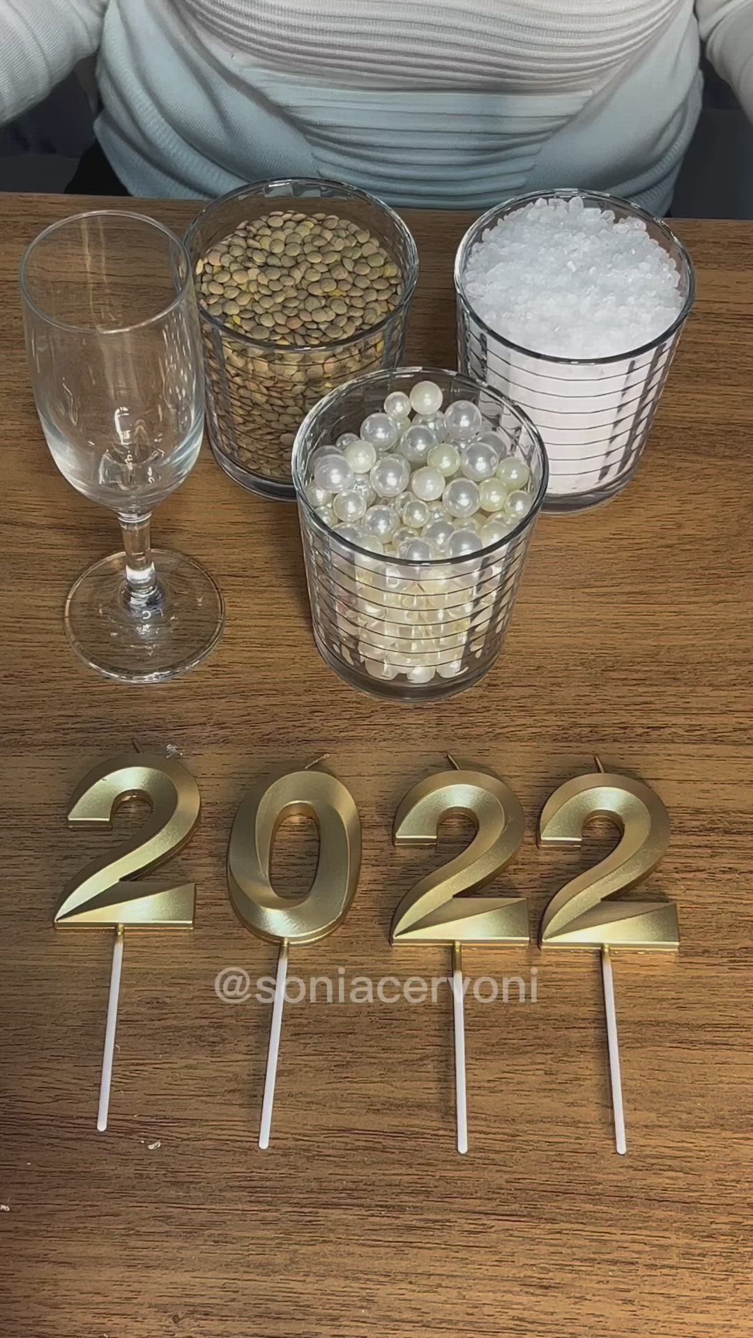 This may contain: candles are lit in the shape of numbers for new year's eve on a table