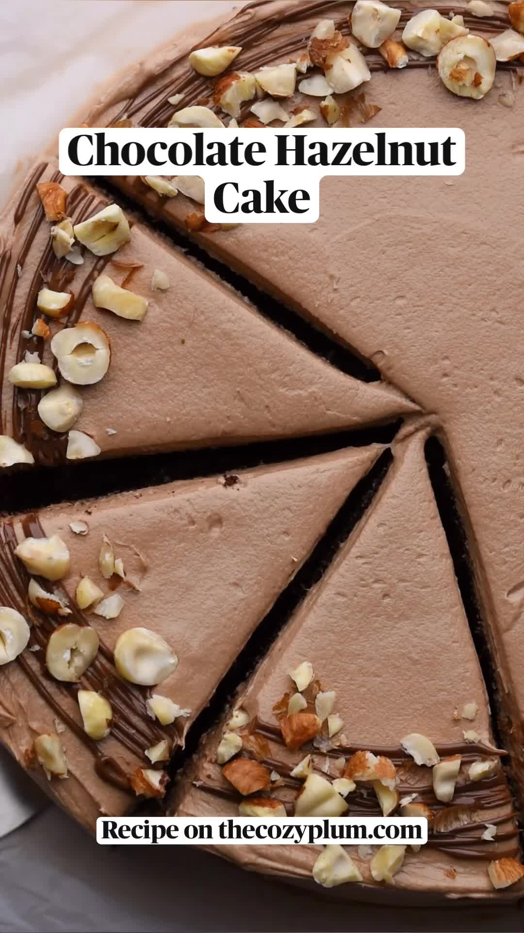 This may contain: a piece of chocolate hazelnut cake is on a plate with a fork in it