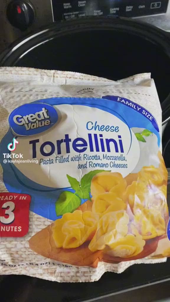 This may contain: a bag of tortellini sitting on top of an oven