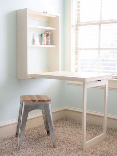 Fold down desk attached to the wall.