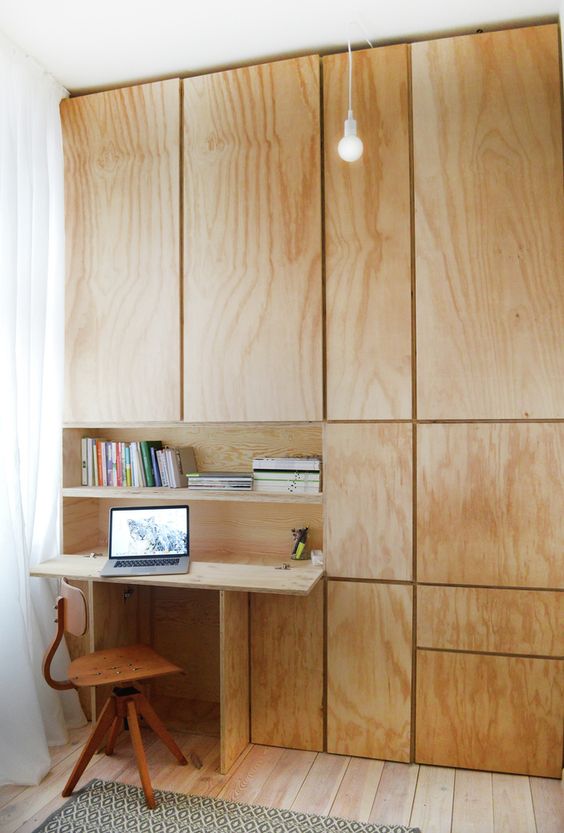 Wooden cabinets that hide a desktop.