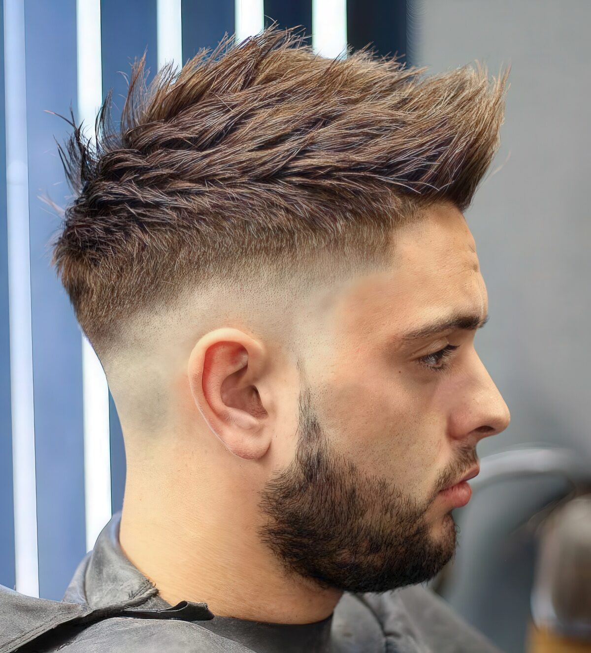 A skin sharp fade faux hawk works well with pointy hair and gives a modern masculine look.