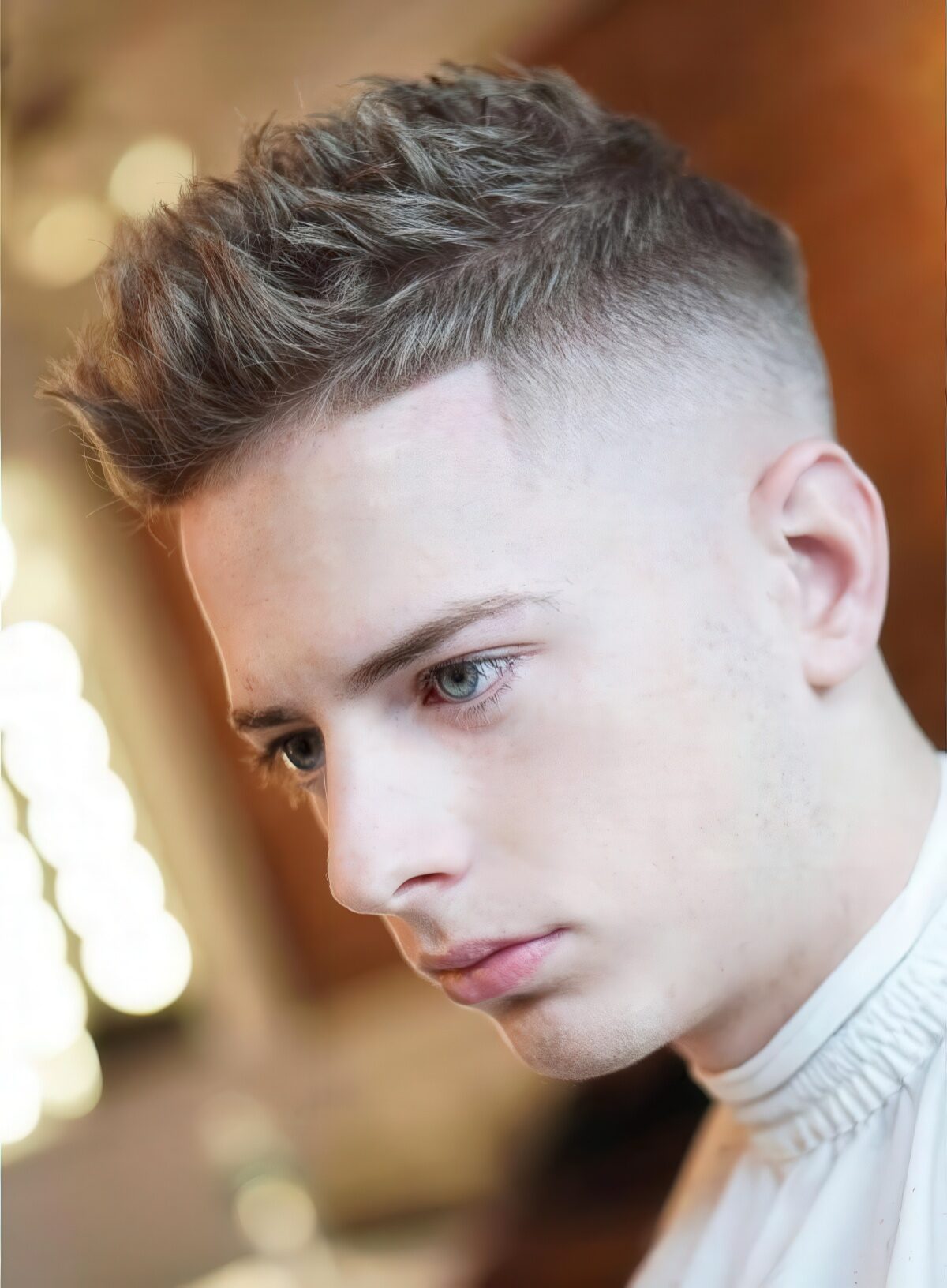 A spiky textured faux hawk with a line up creates a volume and texture.