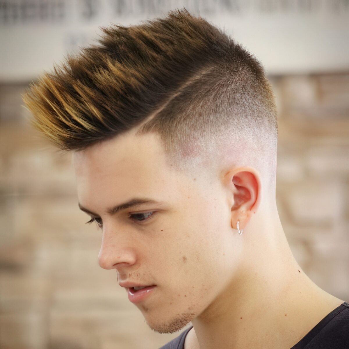 A high taper fade fohawk with highlights and styling up to make a statement.