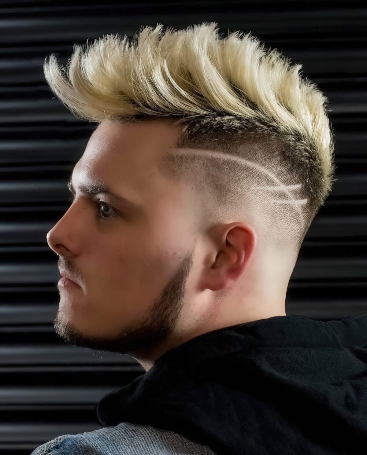 A dyed faux hawk with a disconnected design looks very eye-catchy thanks to the lines and color.