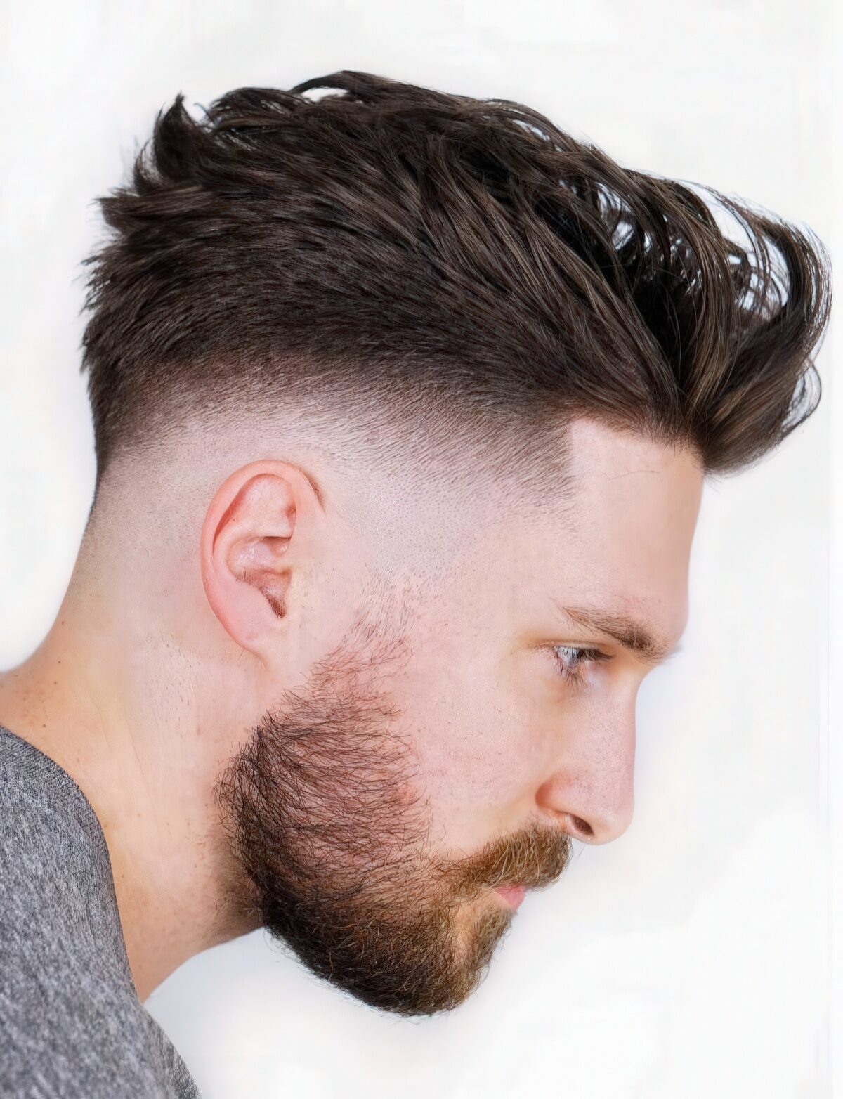 A finger-combed faux hawk creates a little volume on longer hair.