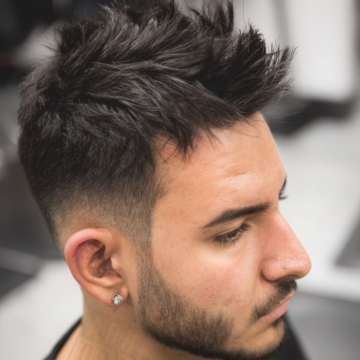 A layered faux hawk brings much texture, is easy to style and a beard adds chic.